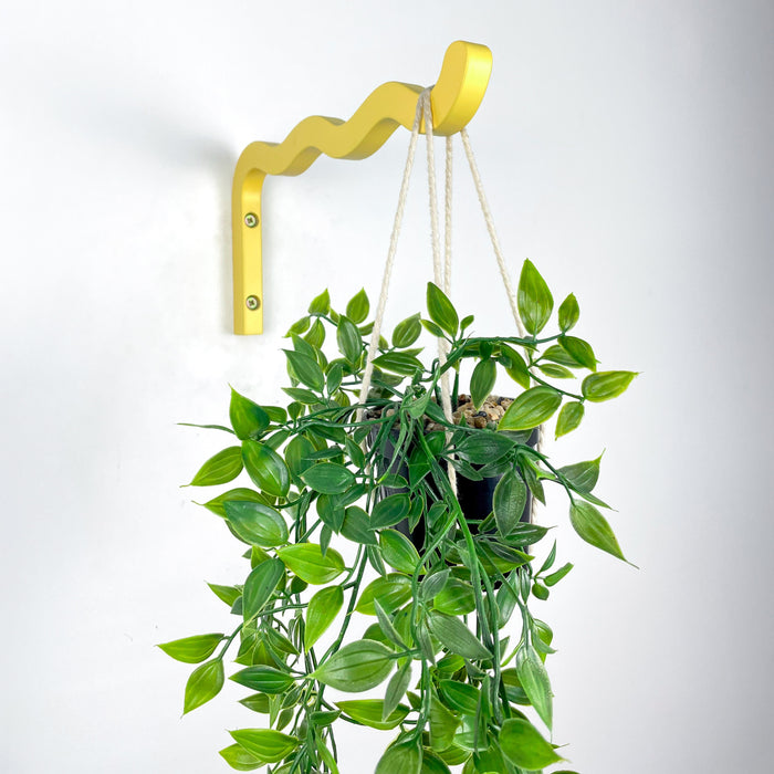 Яскравий жовтий настінний кронштейн для квітів