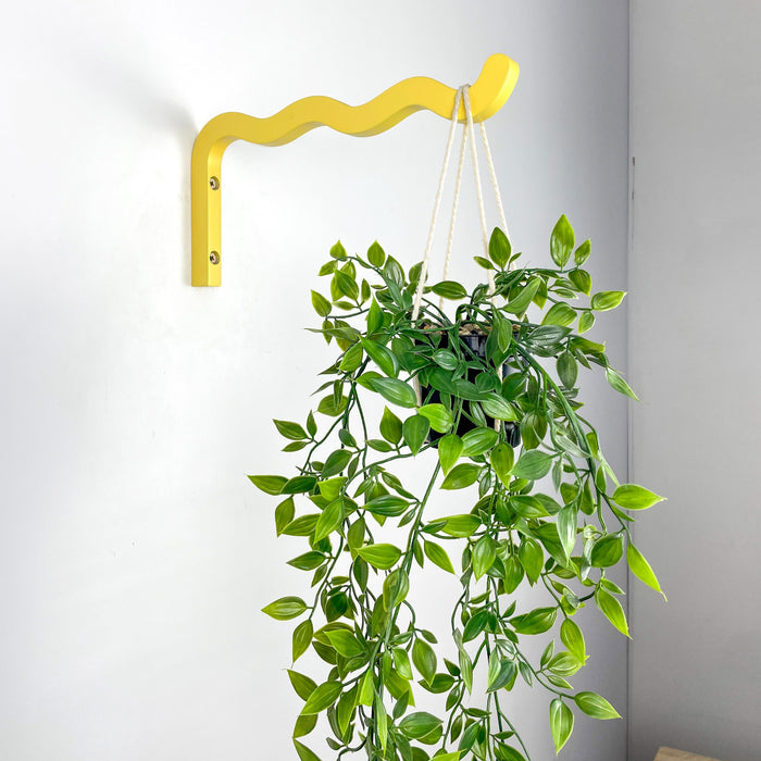 Яскравий жовтий настінний кронштейн для квітів