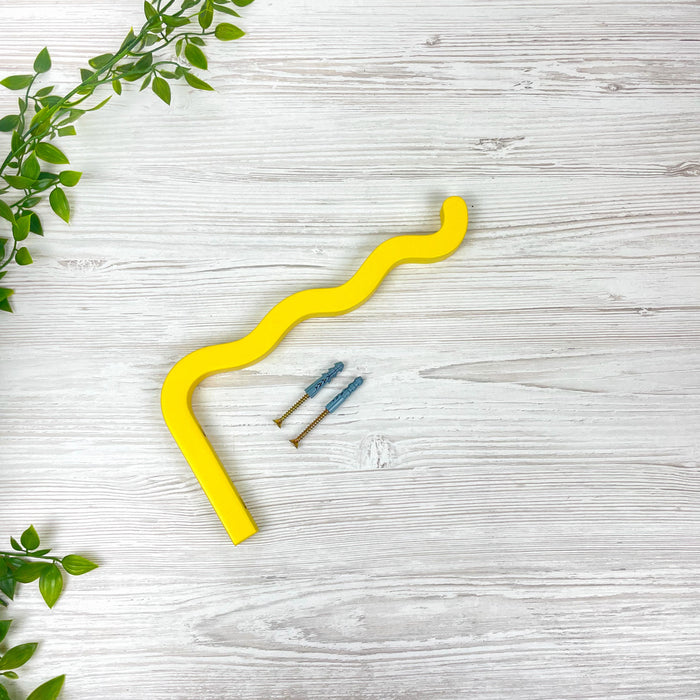 Яскравий жовтий настінний кронштейн для квітів