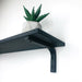 Black Floating Shelf With Wood Brackets - Image 1